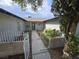 Inviting home entrance featuring a decorative iron gate leading to the front door at 6284 Explorer Dr, Las Vegas, NV 89103