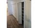 Hallway with several closets and light wood flooring at 6284 Explorer Dr, Las Vegas, NV 89103