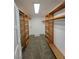 Spacious walk-in closet with built-in shelves, rods and carpeted floor at 6284 Explorer Dr, Las Vegas, NV 89103