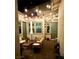 Cozy patio area with string lights, comfortable seating, and views of the surrounding landscape at 704 Webber Park St, Henderson, NV 89011