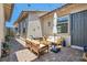 Inviting outdoor seating area with brick pavers, and overhead cafe lights at 704 Webber Park St, Henderson, NV 89011