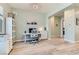 Bright home office features a modern desk, comfortable chair, and stylish decor, creating an inviting workspace at 704 Webber Park St, Henderson, NV 89011