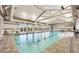 Spacious indoor pool with high ceilings, natural light, and comfortable seating for year-round enjoyment at 704 Webber Park St, Henderson, NV 89011