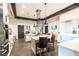 A modern kitchen features stainless steel appliances, large island, and ample counter space at 704 Webber Park St, Henderson, NV 89011