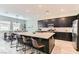 Bright kitchen with a large island with seating and modern stainless steel appliances at 704 Webber Park St, Henderson, NV 89011
