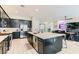 Spacious kitchen featuring an island with seating, stainless steel appliances, and ample counter space at 704 Webber Park St, Henderson, NV 89011