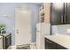 The laundry room includes a washer, dryer, refrigerator, cabinetry and countertop at 704 Webber Park St, Henderson, NV 89011