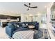 Comfortable living area with a plush sectional sofa, and an open layout that connects to the kitchen at 704 Webber Park St, Henderson, NV 89011