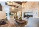 Cozy living room with a stone fireplace, comfortable seating, and stylish decor at 704 Webber Park St, Henderson, NV 89011