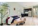 Bright living room with modern finishes, wood floors, and many windows at 704 Webber Park St, Henderson, NV 89011