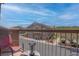 Balcony with views of townhome community, trees, and blue sky above at 7120 Bear Paw Creek St # 101, Las Vegas, NV 89149