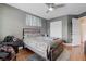 Bedroom with wood-look floors, ceiling fan, and closet for ample storage at 7120 Bear Paw Creek St # 101, Las Vegas, NV 89149