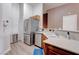Well-lit kitchen featuring stainless steel appliances, wood cabinets, and light countertops at 7120 Bear Paw Creek St # 101, Las Vegas, NV 89149