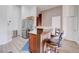 Open kitchen with stainless steel appliances and bar seating at 7120 Bear Paw Creek St # 101, Las Vegas, NV 89149