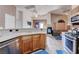 Open-concept kitchen and living room area with a fireplace and lots of natural light at 7120 Bear Paw Creek St # 101, Las Vegas, NV 89149
