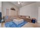A cozy living room with a large sectional couch and modern accents at 7120 Bear Paw Creek St # 101, Las Vegas, NV 89149
