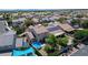 Aerial view of houses with solar panels, well-maintained lawns, and a backyard pool at 7137 Eyebright St, Las Vegas, NV 89131