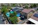 Home showcasing a private backyard with a refreshing swimming pool and solar panels, perfect for outdoor living and energy efficiency at 7137 Eyebright St, Las Vegas, NV 89131