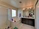 Bright bathroom featuring a shower, soaking tub, and dual sinks offers space and comfort at 7137 Eyebright St, Las Vegas, NV 89131