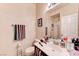 Bathroom includes a vanity with storage, a toilet, and a shower, providing functionality and comfort at 7137 Eyebright St, Las Vegas, NV 89131