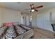 Bedroom with neutral walls, carpet, closet, and ceiling fan features great natural light at 7137 Eyebright St, Las Vegas, NV 89131