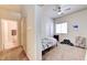 This bedroom features neutral wall color, window, closet, and is located next to the bathroom at 7137 Eyebright St, Las Vegas, NV 89131