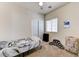 This bedroom features neutral wall color, window, and closet, offering a bright and airy feel at 7137 Eyebright St, Las Vegas, NV 89131