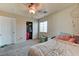 Bright bedroom with carpet offers a modern fan, closet, and natural light at 7137 Eyebright St, Las Vegas, NV 89131