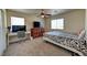 Bright bedroom with carpet, a ceiling fan, and large windows offers a comfortable, customizable space at 7137 Eyebright St, Las Vegas, NV 89131