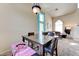 Inviting dining room area with a large wooden table and plenty of natural light at 7137 Eyebright St, Las Vegas, NV 89131