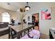 Well-lit dining area adjacent to the living room and kitchen, with ample seating and stylish decor for Gathering meals and gatherings at 7137 Eyebright St, Las Vegas, NV 89131