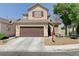 Lovely two-story home with an inviting entrance, well-manicured landscaping, and a spacious two-car garage at 7137 Eyebright St, Las Vegas, NV 89131