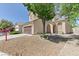 Beautiful home featuring a two-car garage and a landscaped front yard with mature trees providing shade and curb appeal at 7137 Eyebright St, Las Vegas, NV 89131