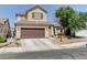 Charming two-story home with a well-maintained front yard and a two-car garage in a residential neighborhood at 7137 Eyebright St, Las Vegas, NV 89131