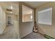 Hallway with neutral walls, carpet, and natural light lead to a spacious upper floor at 7137 Eyebright St, Las Vegas, NV 89131
