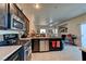 Open kitchen featuring stainless steel appliances, granite countertops, and modern fixtures at 7137 Eyebright St, Las Vegas, NV 89131