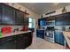 Well-equipped kitchen with dark cabinets, stainless steel appliances, and ample counter space at 7137 Eyebright St, Las Vegas, NV 89131