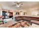 Comfortable living room with dark kitchen cabinets and a large sectional sofa at 7137 Eyebright St, Las Vegas, NV 89131