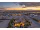 Beautiful aerial view of property at sunset, boasting mature trees and city views at 743 N Orleans St, Henderson, NV 89015