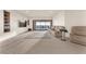 Finished basement featuring a large sectional sofa and access to the backyard at 743 N Orleans St, Henderson, NV 89015