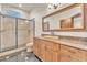 Spacious bathroom with granite counters, undermount sink, walk-in shower, and stylish vanity at 743 N Orleans St, Henderson, NV 89015