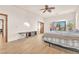 Spacious main bedroom with wood floors, neutral walls, access to a balcony, and modern furniture at 743 N Orleans St, Henderson, NV 89015