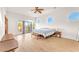 Spacious bedroom featuring wood floors, ample natural light, and access to a balcony at 743 N Orleans St, Henderson, NV 89015