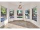 Charming breakfast nook with multiple windows showcasing the landscaped backyard at 743 N Orleans St, Henderson, NV 89015