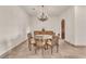 Formal dining room with chandelier, seating for eight, and built-in cabinetry at 743 N Orleans St, Henderson, NV 89015
