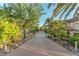 Long driveway bordered by mature landscaping leading up to a portico at 743 N Orleans St, Henderson, NV 89015