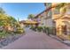 Charming home featuring a long driveway with mature landscaping and a portico at 743 N Orleans St, Henderson, NV 89015