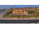 Two-story home with tile roof, outdoor patio, desert landscaping, mountain views, and turf at 743 N Orleans St, Henderson, NV 89015