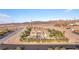 A beautiful stucco home has a well-maintained landscape and plenty of parking for Gathering and visitors at 743 N Orleans St, Henderson, NV 89015