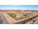 Expansive desert estate with tile roof, lush trees, wrought iron fence and beautiful landscaping at 743 N Orleans St, Henderson, NV 89015